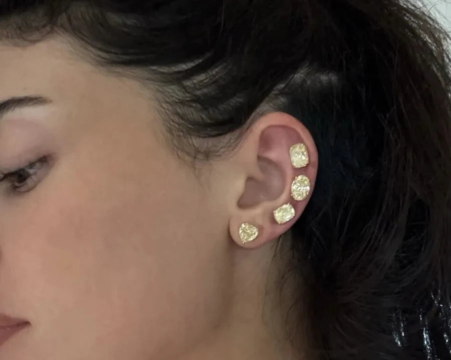 Kylie Jenner showing her canary yellow diamond ear stack, September 2026