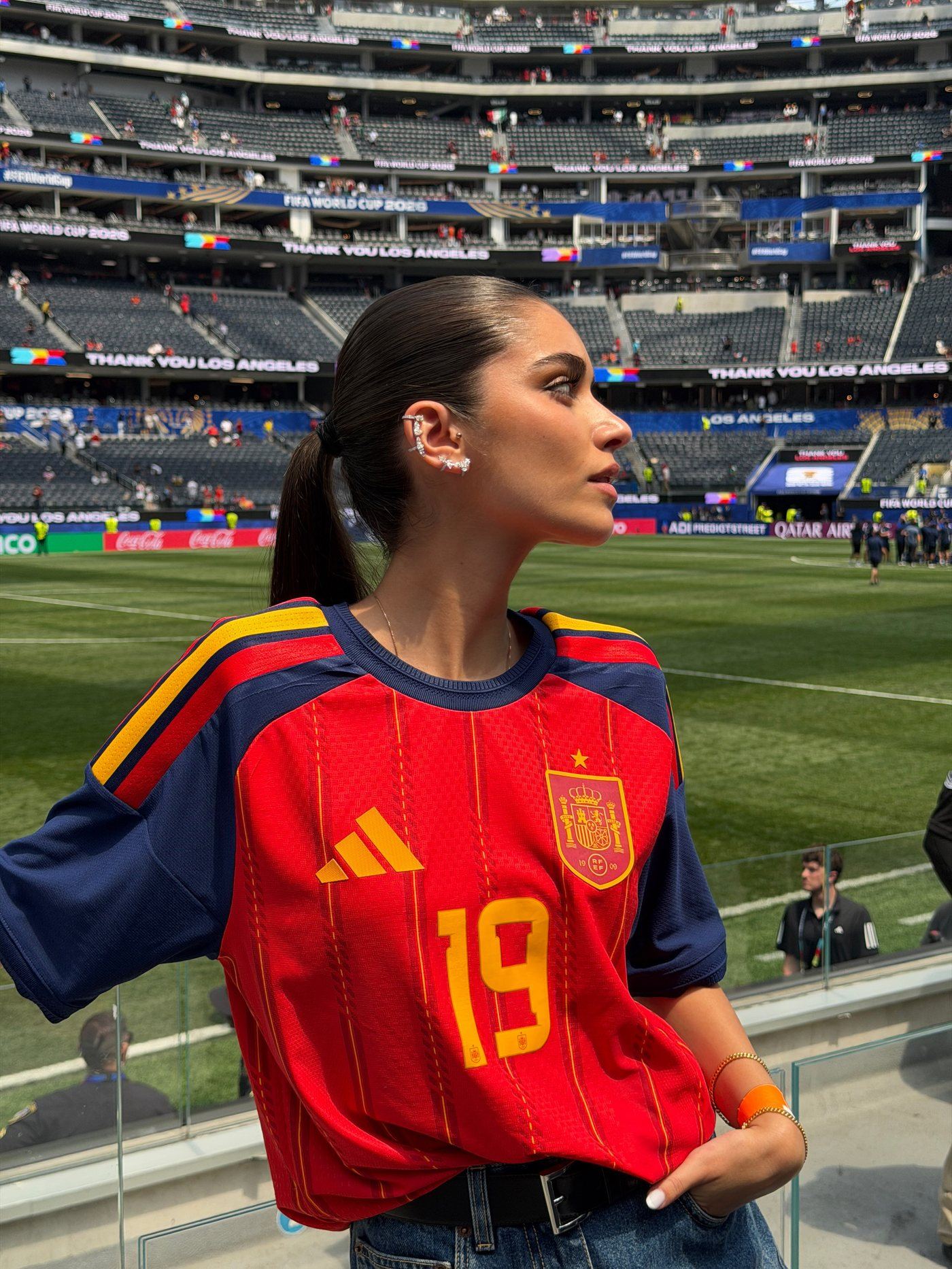 Inés García wearing a curated ear stack of diamond climbers and an ear cuff at the 2026 World Cup